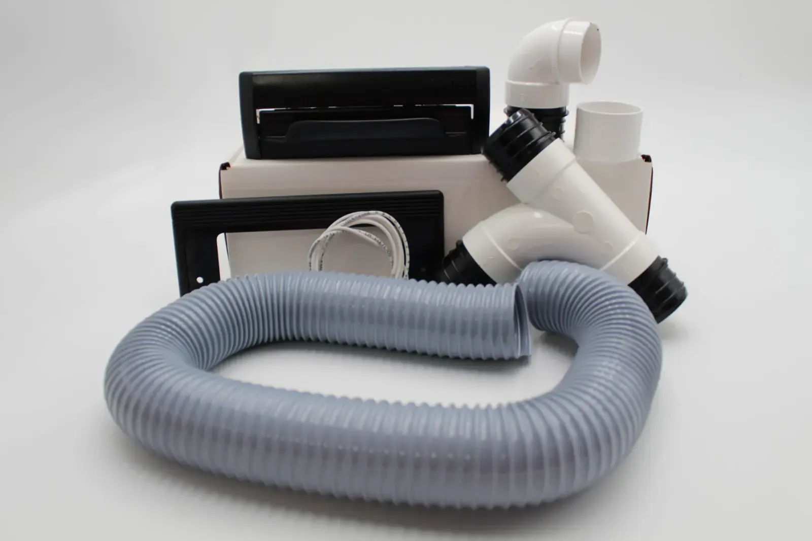 The A-950-X VacPort installation kit: the VacPort, trim plate, fittings, hose and wire